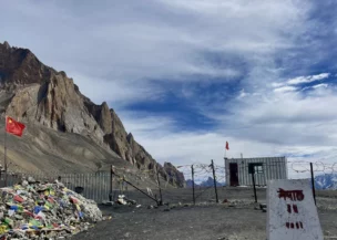 High-altitude viewpoint with Tibet border marker at Manaslu Circuit Trek