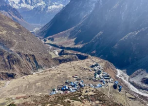 Samdo Village nestled below snow-capped Himalayan peaks on the Manaslu Circuit Trek in Nepal.